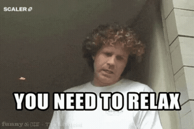 Man With Curly Hair Saying Relax GIF