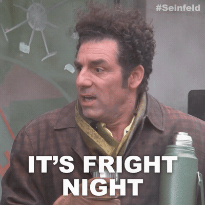 Man With Curly Hair Says It's Fright Night Holding Thermos GIF