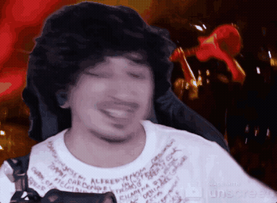 Man With Curly Hair Smiling In Alfred T-Shirt GIF