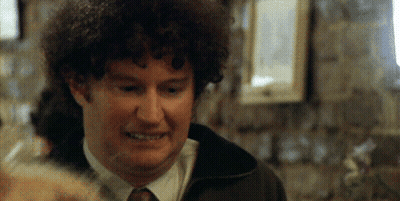 Man With Curly Hair Smiling In Tie GIF
