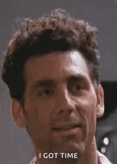 Man With Curly Hair Smiling Saying I Got Time GIF