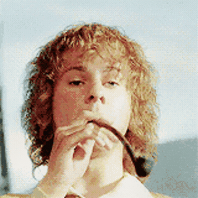Man With Curly Hair Smoking Pipe GIF