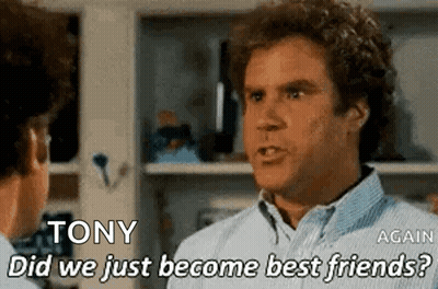 Man With Curly Hair Talking To Another Man GIF
