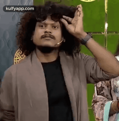 Man With Curly Hair Wearing Sunglasses And Microphone Making Funny Face GIF