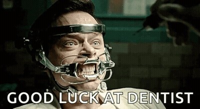 Man With Dental Brace Sitting GIF