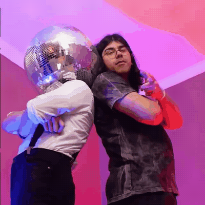 Man With Disco Ball Head Next To Microphone GIF