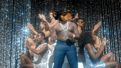 Man With Dog's Head Surrounded By Women GIF