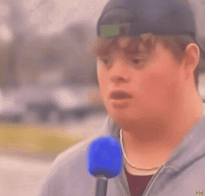 Man With Down Syndrome Holding Blue Microphone Saying Mayonnaise GIF