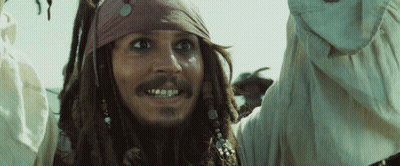 Man With Dreadlocks And Bandana Looking At Camera GIF