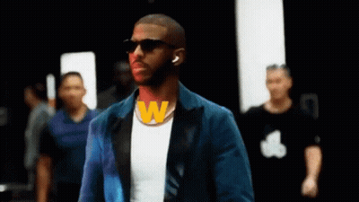 Man With Dreadlocks And Beard In Front Of Arabic Sign GIF