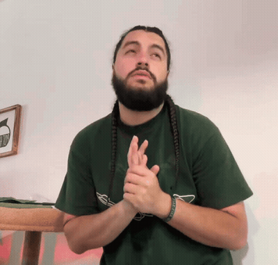 Man With Dreadlocks And Beard In Green Shirt Saying No GIF