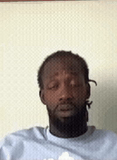 Man With Dreadlocks And Beard Sitting GIF