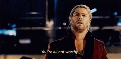 Man With Dreadlocks And Beard Standing By Pillar GIF