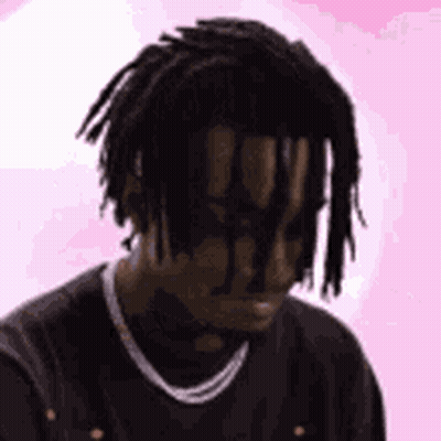 Man With Dreadlocks And Chain In Black Shirt GIF