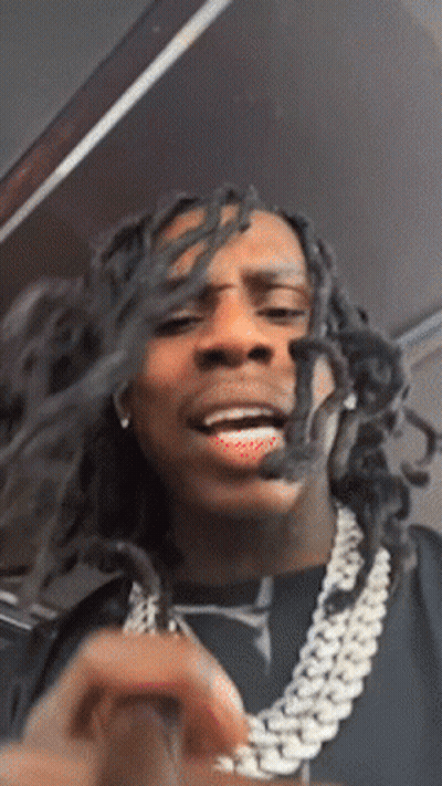 Man With Dreadlocks And Chain Making Face GIF
