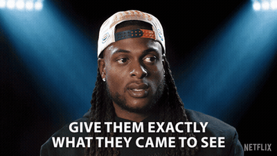 Man With Dreadlocks And Hat Says Give Them Exactly What They Came To See GIF