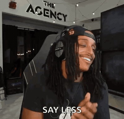 Man With Dreadlocks And Headphones Smiling In Chair GIF