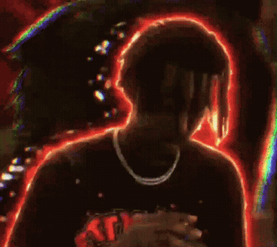 Man With Dreadlocks And Necklace In Front Of Crowd GIF