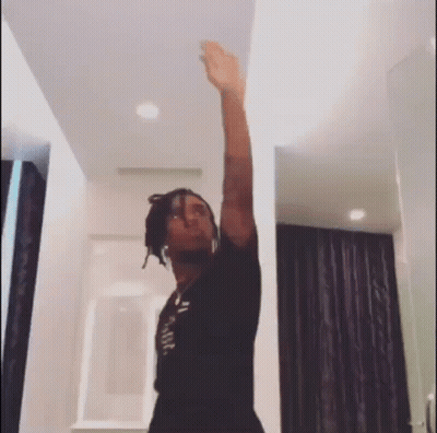 Man With Dreadlocks Arm Up GIF