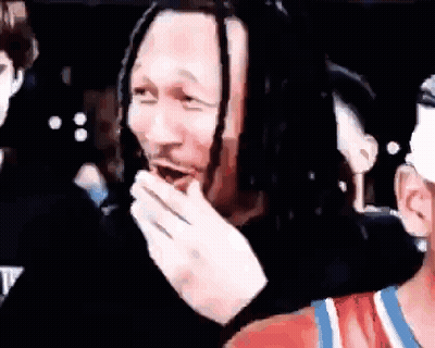 Man With Dreadlocks Covering Mouth GIF