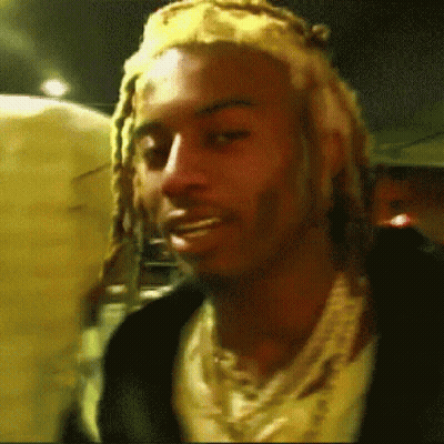 Man With Dreadlocks, Headband, And Necklace GIF