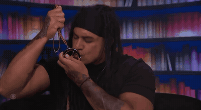 Man With Dreadlocks Holding Keanu Medal GIF