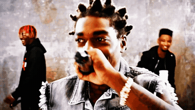Man With Dreadlocks Holding Microphone GIF