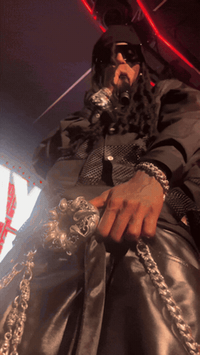 Man With Dreadlocks Holding Microphone Saying A GIF