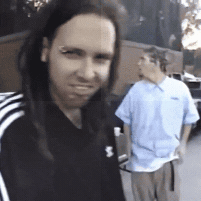 Man With Dreadlocks In Black Adidas Shirt GIF