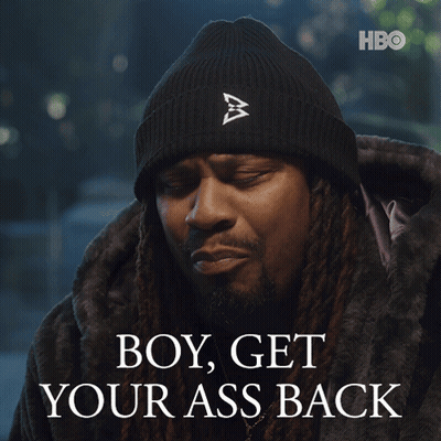 Man With Dreadlocks In Black Beanie And Fur Coat Saying Boy Get Your Ass Back GIF