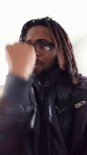 Man With Dreadlocks In Black Jacket GIF