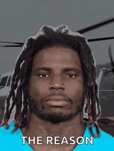 Man With Dreadlocks In Blue Shirt Saying The Reason GIF