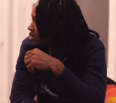 Man With Dreadlocks In Blue Supreme Shirt GIF