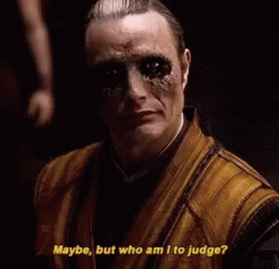 Man With Dreadlocks In Front Of Two Robots The Illuminati GIF