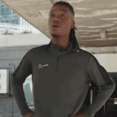 Man With Dreadlocks In Gray Nike Shirt GIF