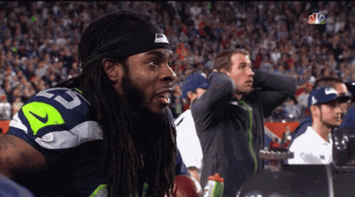 Man With Dreadlocks In Jersey Number 52 GIF