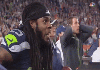 Man With Dreadlocks In Nike Headband Watching Football GIF