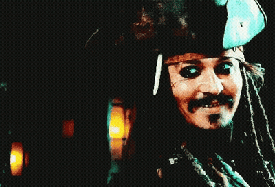 Man With Dreadlocks In Pirate Hat Holding Sword GIF