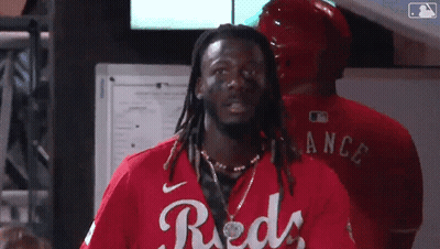 Man With Dreadlocks In Red Shirt Saying Reds GIF