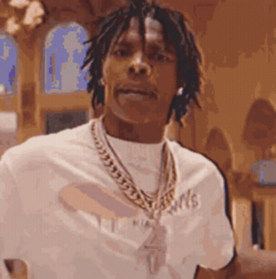 Man With Dreadlocks In White Shirt And Gold Chain GIF