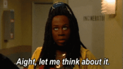 Man With Dreadlocks In Yellow Shirt Saying Aight Let Me Think About It GIF