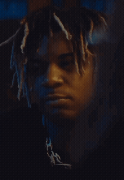 Man With Dreadlocks Looking At Camera GIF
