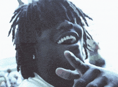 Man With Dreadlocks Making Peace Sign GIF