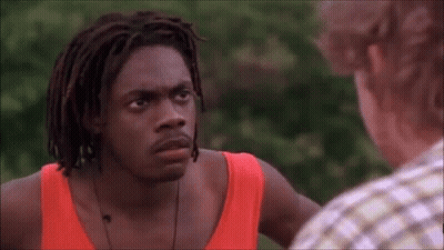 Man With Dreadlocks Next To Man In Red Tank Top GIF
