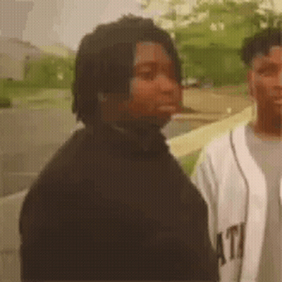 Man With Dreadlocks Next To Man In White Jersey GIF