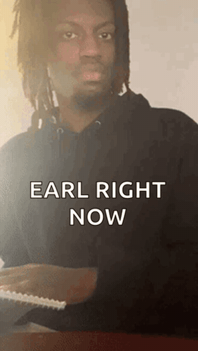 Man With Dreadlocks Sitting At Table Saying Earl Right Now GIF