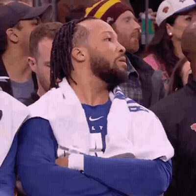 Man With Dreadlocks Sitting Crossed Arms GIF