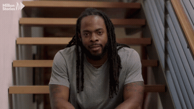 Man With Dreadlocks Sitting On Stairs Million Stories Logo GIF