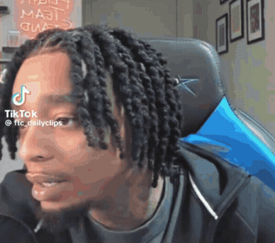Man With Dreadlocks Sitting With TikTok Sticker On Forehead GIF