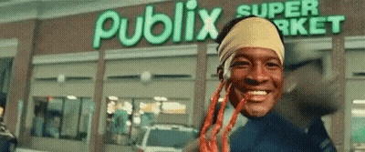 Man With Dreadlocks Smiling In Front Of Publix Super Market GIF